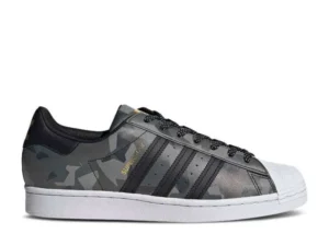 adidas-superstar-black-gold-camo.webp ADIDAS SUPERSTAR ‘BLACK GOLD CAMO’
